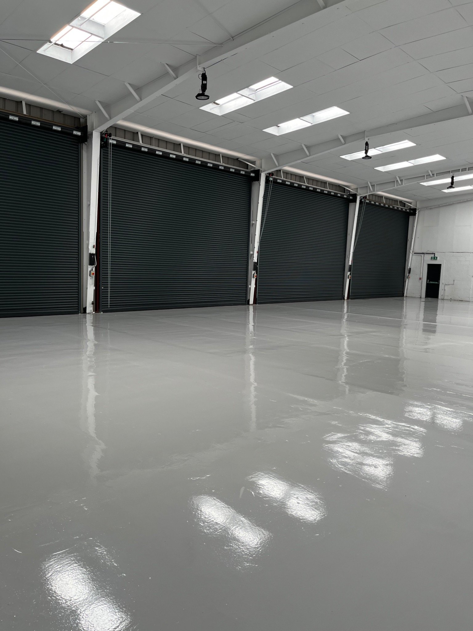 Commercial workshop with freshly finished floor by Fratton Group PTY LTD