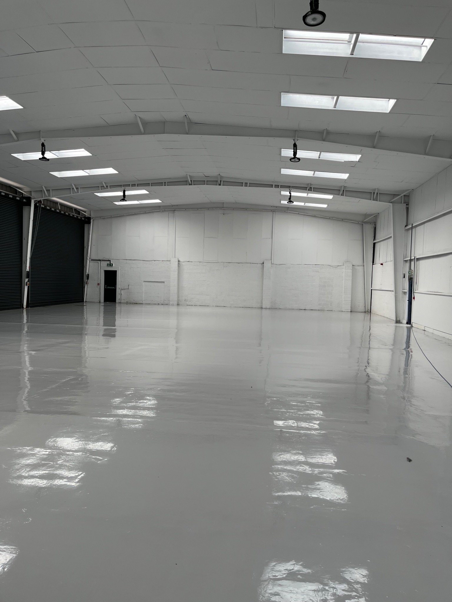 Large commercial space with freshly finished floor by Fratton Group PTY LTD