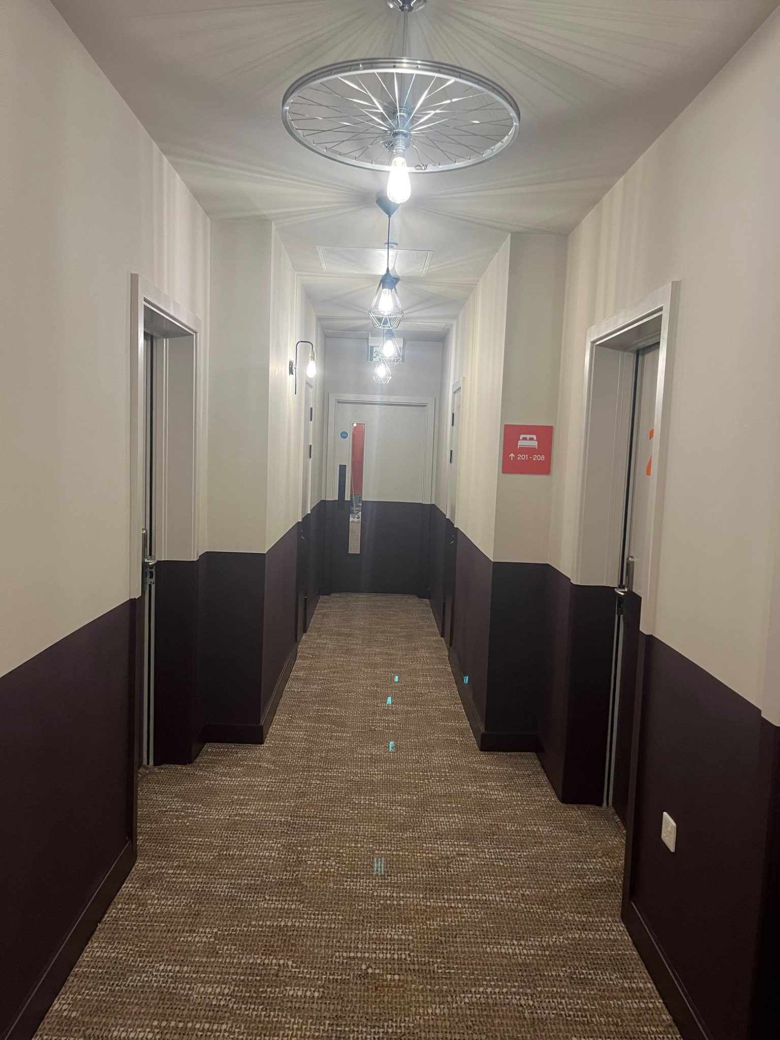 Long freshly finished corridor with decorative lighting