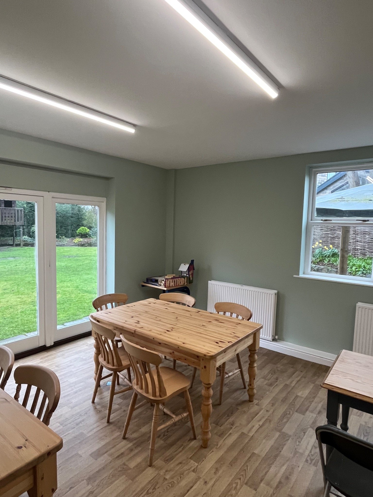 Dining room with timber furniture and garden outlook